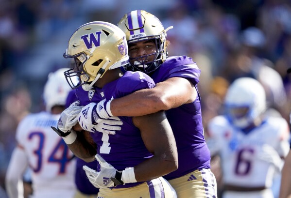 Purple and gold football uniforms top